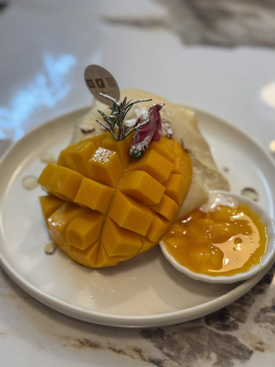 A hedgehog-cut mango with a crepe and mango sauce at Naya Dessert